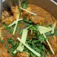 Chicken Karahi · Small pieces of chicken cooked in olive oil with special herbs and spices.