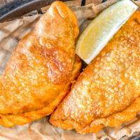 Empanadas · Choice of ecuadorian, Colombian, Cuban, bolivian turnover filled with chicken of beef, plant...
