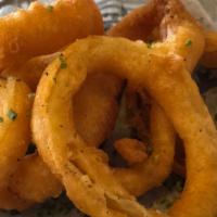 House Battered Onion Rings · Onions freshly coated with beer batter and served with ranch
