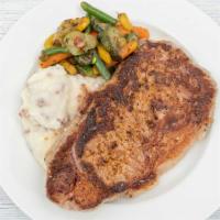 House Ribeye · Selected hand cut steak. Served with mashed potatoes and sauteed veggies