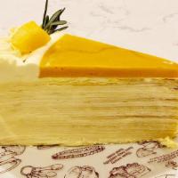 Mango Mille Crepes Cake · Over 20 layers of crepe cake with delicious mango and passionfruit fresh cream.
