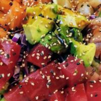 Ichiban Poke Bowl · Mix vegetable topping with fresh chopped salmon, tuna, white fish, avocado and sesame seed.