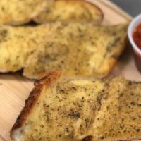 Homemade Garlic Bread · with marinara sauce. Add cheese for an additional charge.