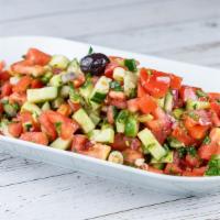 Shepherd Salad · Fresh chopped tomatoes, onions, parsley, and cucumbers served with olives, olive oil and vin...