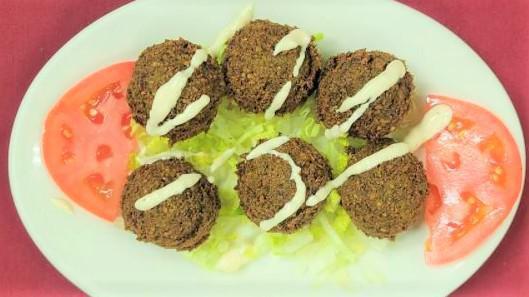 Falafel (6 Pieces) · Ground chickpeas blended with fresh onions and parsley, served with tahini sauce which contains dairy