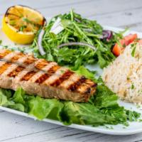 Salmon · Char-grilled filet salmon in our special spices served with rice and a side salad.