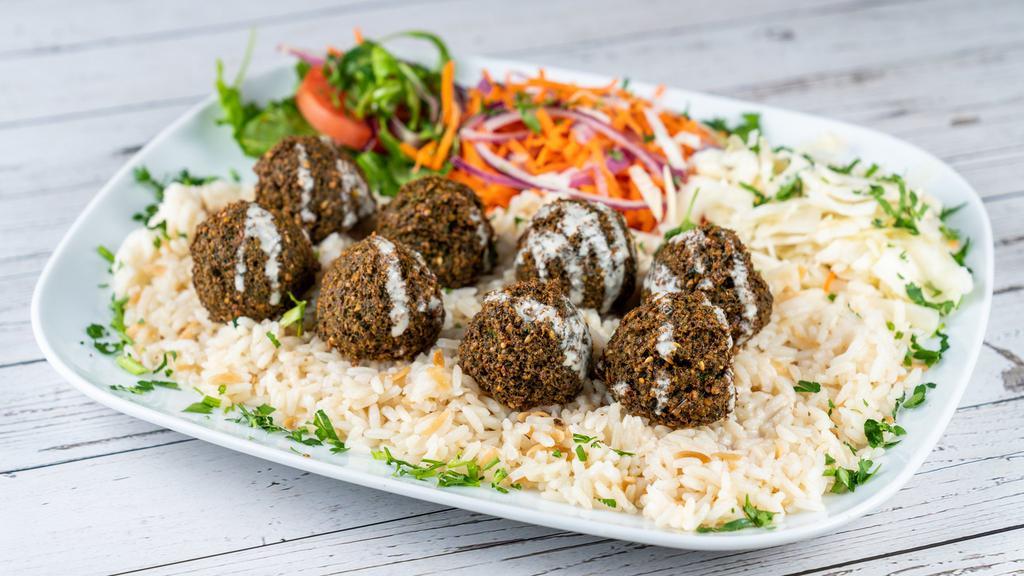 Falafel Platter · Ground chickpeas blended with fresh onions and parsley, served with tahini sauce which contains dairy