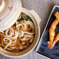 Nabeyaki Udon · Udon noodle soup and two pieces of shrimp tempura, fish cake, mushroom, and vegetables.