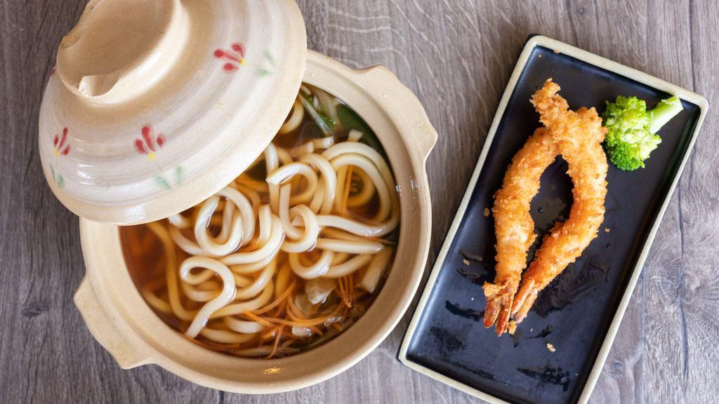 Nabeyaki Udon · Udon noodle soup and two pieces of shrimp tempura, fish cake, mushroom, and vegetables.