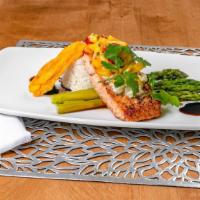 Seared Salmon Fillet · North Atlantic salmon topped with mango salsa seared and served with vegetable.