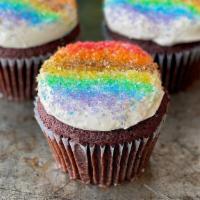 Pride Cupcake · Our Red Velvet Cupcake finished with cream cheese buttercream, topped with crystal sugar pri...