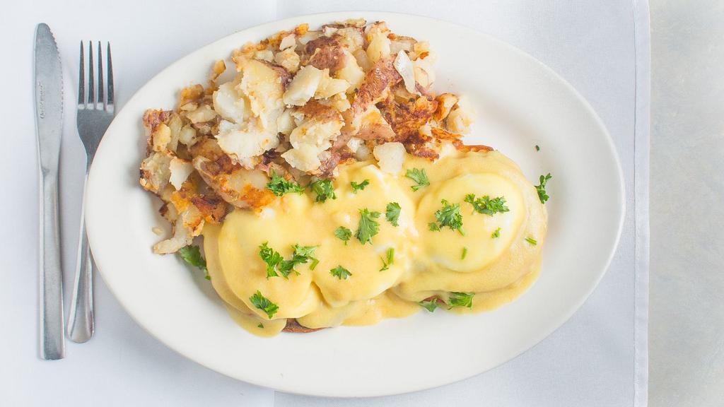 Eggs Benedict · 3 poached eggs on a toasted English Muffin with Canadian bacon topped with Hollandaise Sauce.