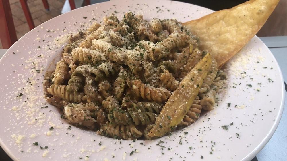 Rasta Pasta · Tri-Colored Rotini, Julienne Vegetables, Herb Coconut Parmesan Cream Sauce. Add protein for an additional price.