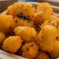 Tater Tots With Miso Ranch · Tossed with furikake and served with miso ranch