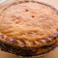 Aussie Meat Pie · Iconic grab-and-go pastry from Down Under, featuring vegemite and Worcestershire sautéed wit...