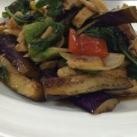 Stir-Fried Eggplant · Chinese eggplant, sweet chili paste, onion, bell pepper and basil leaves. YCOM