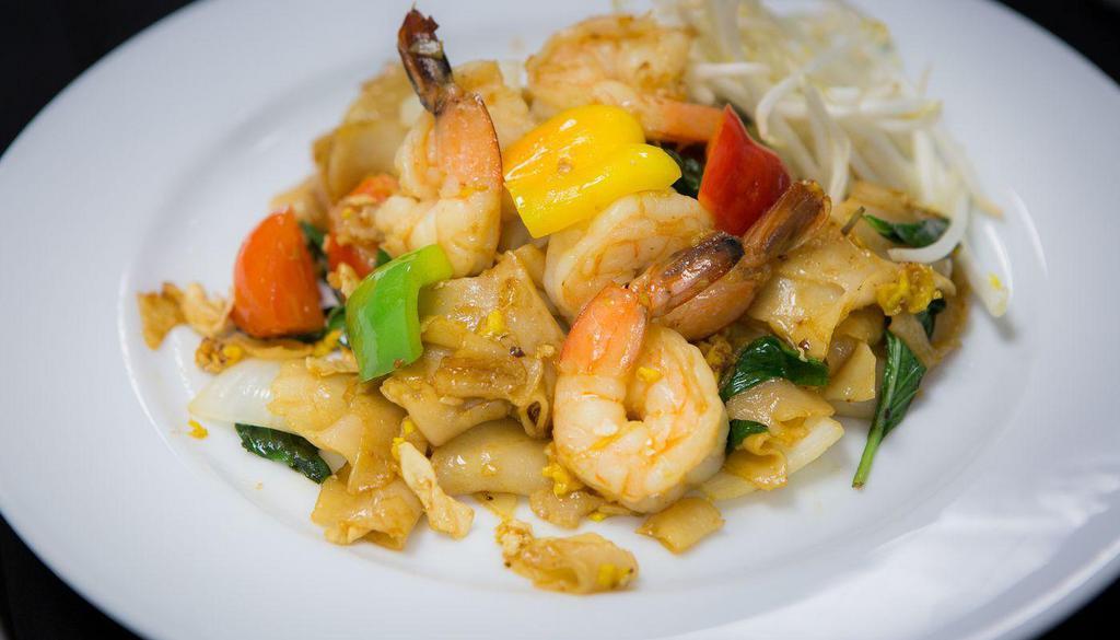 Drunken Noodle · Stir-fried wide-size rice noodle with Thai chili, egg, onion, bell pepper, tomato and basil. YCOM