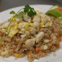 Crab Fried Rice · Jasmine rice blended with egg, diced mixed vegetables and Dungeness crab meat.