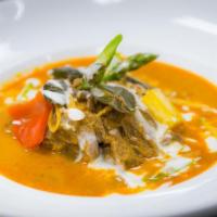 House Special Beef Curry · Slow-cooked chunk beef sirloin in Pa Naeng curry, asparagus and bell peppers.