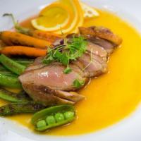 Duck Breast With Tangerine Sauce · Seared marinated Duck breast served with house tangerine sauce and roasted assorted vegetabl...