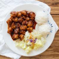 Spicy Garlic Chicken · Served with rice and salad