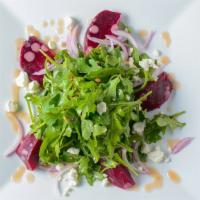 Roasted Beets · Grilled chicken, baby arugula, candied pecans, red onion, roasted shallot vinaigrette, goat ...