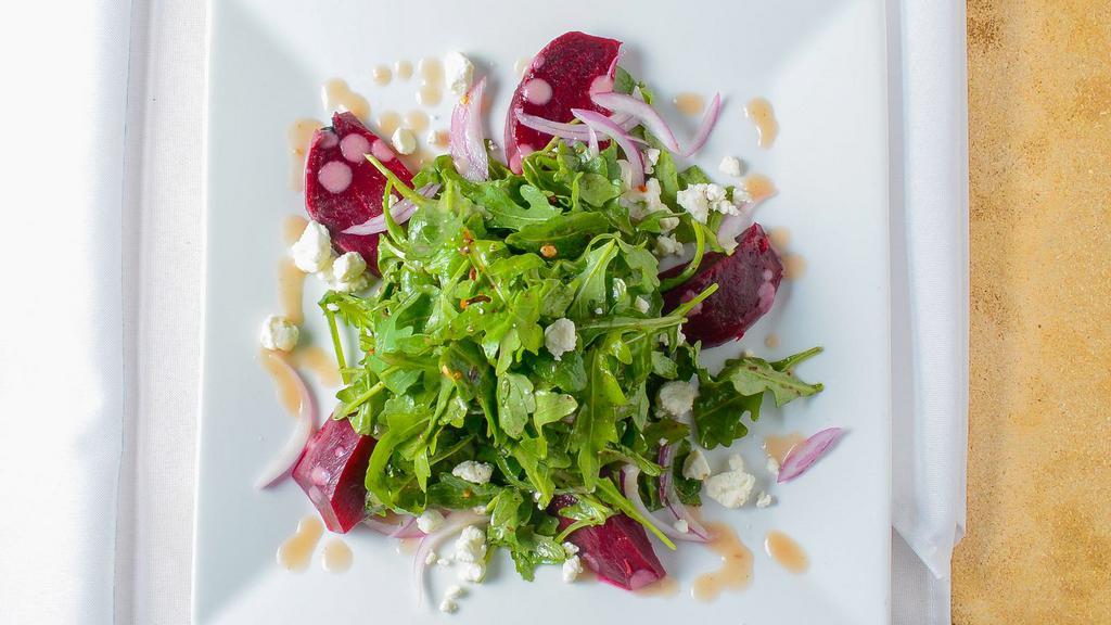 Roasted Beets · Grilled chicken, baby arugula, candied pecans, red onion, roasted shallot vinaigrette, goat cheese crumble.