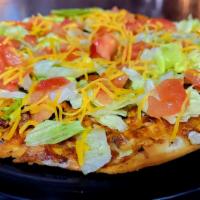 Hector’S Taco Pie
 · Seasoned ground beef, onions & Cheddar with a salsa base, cooked & topped with fresh tomatoe...