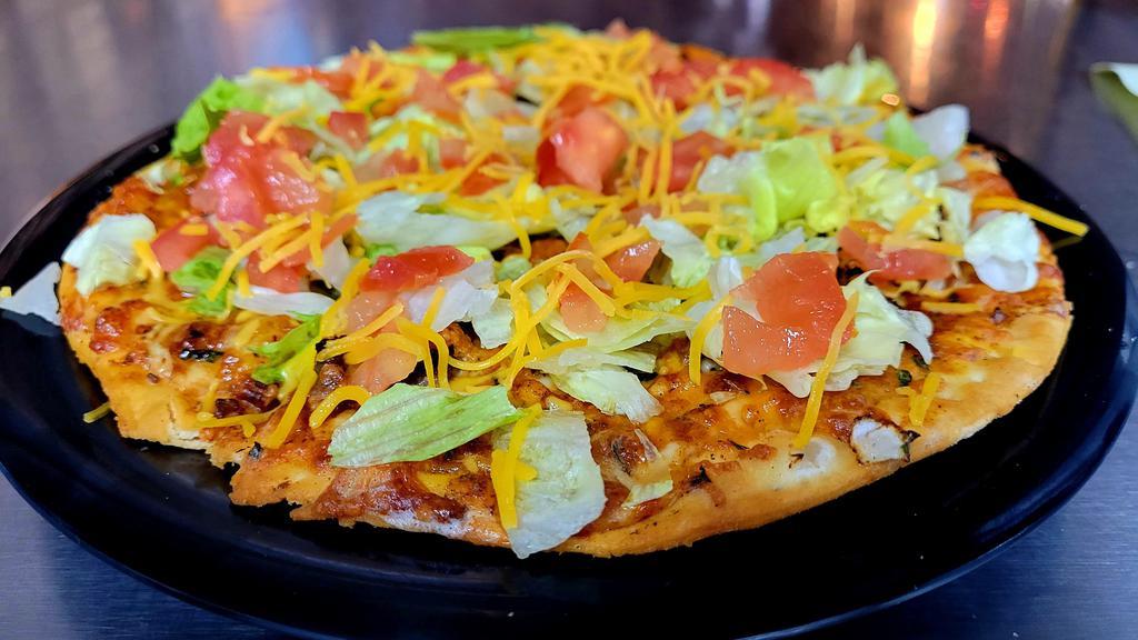 Hector’S Taco Pie
 · Seasoned ground beef, onions & Cheddar with a salsa base, cooked & topped with fresh tomatoes & lettuce.
