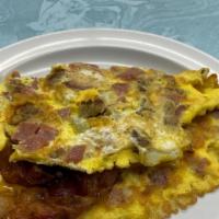 All American Omelet · Bacon, Sausage, Taylor ham, and American cheese. Made with three eggs, served with your choi...