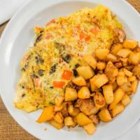 Vegetarian Omelet · Vegetarian.  Mushrooms, onions, peppers, and tomatoes. Made with three eggs, served with you...