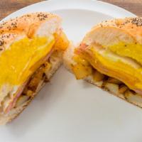 The Complete · Taylor ham, egg, cheese, and potato on a hard roll.