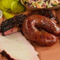 Three Meat Plate · Choose from brisket, sausage, ribs or pulled pork. Includes one side.