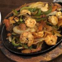 Pollo Seafood · Grilled chicken breast with shrimp, crabmeat, and tomatoes, mixed in a nacho cheese sauce. S...