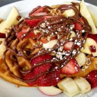 The Nu-Ffle · Waffle topped with apples, banana, strawberries, and pecans drizzled with Nutella sauce.