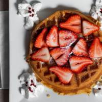 Tropical Waffle · With fresh strawberries or banana and whipped cream.