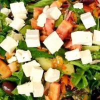 Greek Salad · A mixture of lettuce, tomato, cucumbers, peppers and onions tossed with olive oil and wine v...