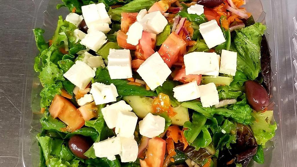 Greek Salad · A mixture of lettuce, tomato, cucumbers, peppers and onions tossed with olive oil and wine vinegar topped with feta cheese and black olives