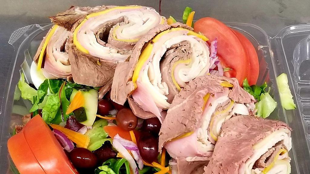 Chef'S Salad · Sliced turkey, ham, roast beef and mixed cheeses atop mixed greens tossed with diced tomatoes, olives, peppers, cucumbers, red onion and sliced hard boiled egg with your choice of dressing.