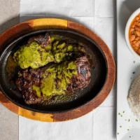 New! Churasco · Grilled tender skirt steak cooked to perfection on a sizzling plate, served with white rice,...