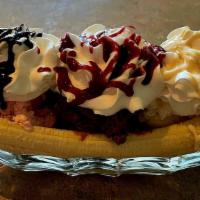 Banana Split · Hand made specialty with walnuts, fresh banana and 3 scoops of ice cream topped with whipped...