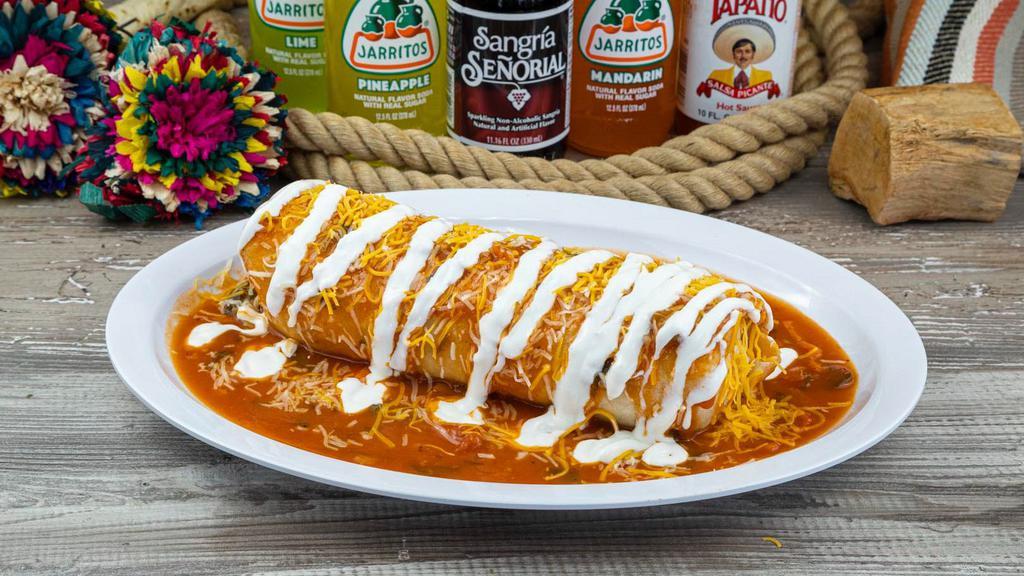 Wet Burrito · Burrito stuffed with your choice of meat, rice, beans, salsa, cilantro, and onions. Topped with salsa rancher@, sour cream, and cheese.
