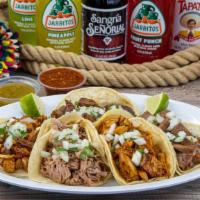 4 Tacos · Small corn tortillas tacos with your choice of meat, salsa, cilantro and onions.