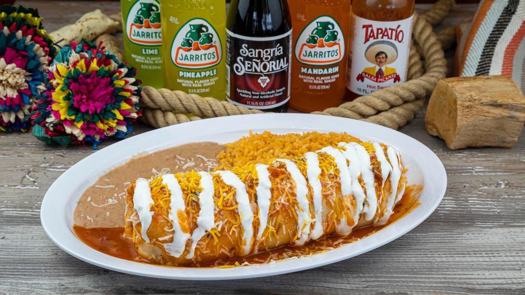 Burrito Plate · Burrito stuffed with choice of meat, onion, cilantro, red salsa. Topped with salsa ranchero, cheese and sour cream. Rice and beans on the side.