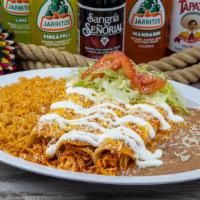 Enchilada Plate · Three enchiladas with your choice of meat, topped with sour cream, cheese, lettuce and tomat...