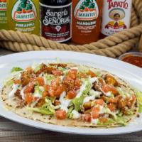 Huarache · Deep fried thick corn tortilla topped with your choice of meat, beans, shredded cabbage, tom...