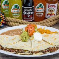 Quesadilla Plate · Large flour tortilla stuffed with your choice of meat and cheese. Served with rice, beans, s...