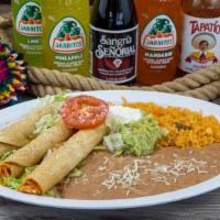 Taquitos Plate · Three rolled fried corn tortillas stuffed with your choice of shredded beef or shredded chic...