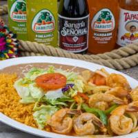 Shrimp Fajitas · Juicy grilled shrimp with onions and bell peppers. Severed with rice, beans, green salad, an...