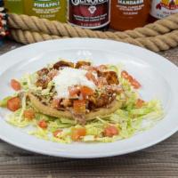 Sope · Fried thick corn base with your choice of meat, beans, cabbage, tomatoes, sour cream, and co...